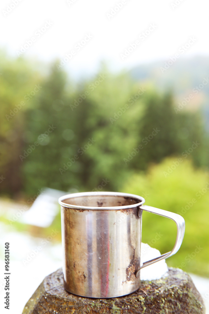 Coffee on wooden fence, on nature background