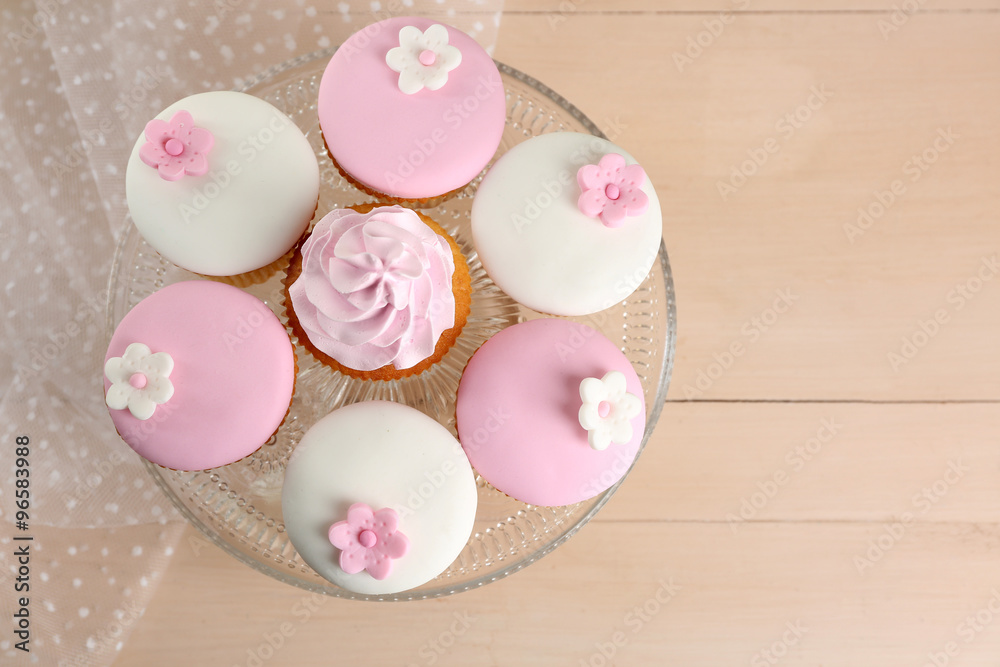 Tasty cupcake on stand, close-up