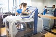 © Wavebreak Media - Woman using an anti gravity treadmill beside trainer