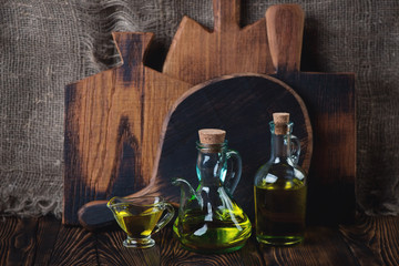 Wall Mural - Glass bottles and pialat with olive oil, selective focus