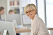 © goodluz - Senior businesswoman standing in office