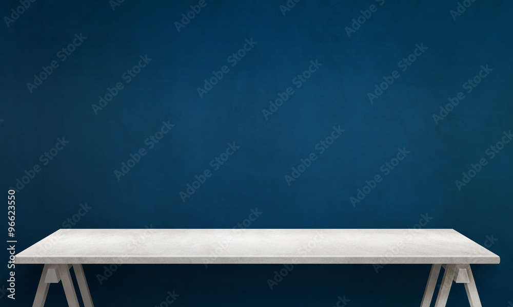 Modern white table with legs and free space. Blue wall texture in background. - obrazy, fototapety, plakaty 