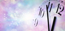 Minutes Before Midnight At New Year - Wide Banner  With A Partial Clock Face Showing Five Minutes To Midnight On Right Side With Copy Space On Left On A Misty Blue And Pink Sparkling Background