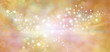 Golden starry glitter warm toned bokeh background banner - Wide autumnal orange and gold  sparkling glittery star speckled background with a whoosh of movement in the middle