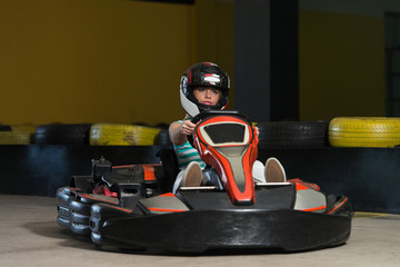 Wall Mural - Young Woman Driving Go-Kart Karting Race