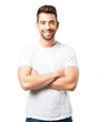© asierromero - young man crossing arms