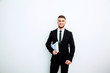 © kanashkin - Portrait of an handsome businessman with a folder