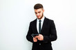 © kanashkin - Portrait of an handsome businessman with a tablet