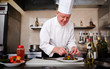 © pressmaster - Cook at restaurant