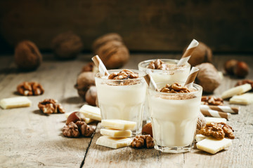 dessert of white chocolate and walnuts, selective focus