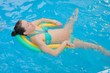 © UA_Color - Water Yoga/ a pregnant woman does her yoga exercises at the pool