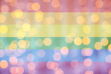 Wall Mural - blurred golden lights over rainbow flag background