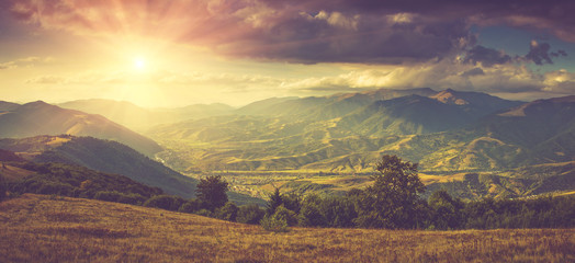 panoramic landscape in autumn mountains with sunlight.