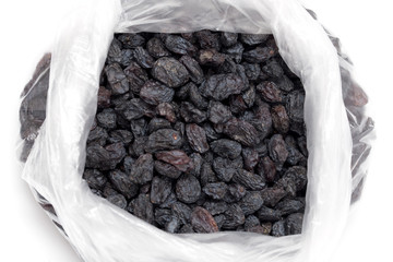 Black raisins in a plastic bag