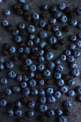 Canvas Print - fresh blueberry and blackberry on black background