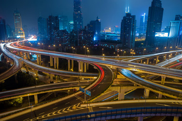 Modern city traffic road at night. Transport junction.