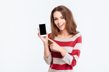 Canvas Print - Cheerful woman showing blank smartphone screen