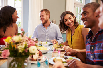 Poster - Friends At Home Sitting Around Table For Dinner Party