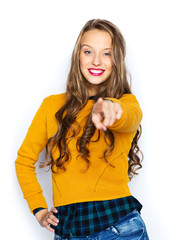 Wall Mural - happy young woman or teen pointing finger on you