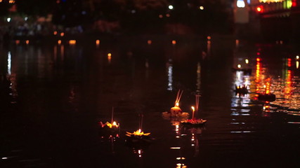 Wall Mural - Loi Krathong festival in Chiangmai Thailand, floating basket of flowers on river during celebrated on Thai full moon lunar calendar