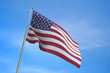 3D USA flag floating in the wind on blue sky background