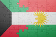 © luzitanija - puzzle with the national flag of kurdistan and kuwait