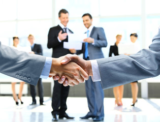 Wall Mural - Business handshake and business people