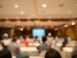 © TuTheLens - blurred people sitting rear at the business conference