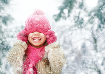 Wall Mural - girl playing on a winter walk