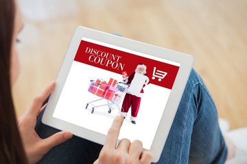 Poster - Composite image of teen using a tablet pc sitting on the floor