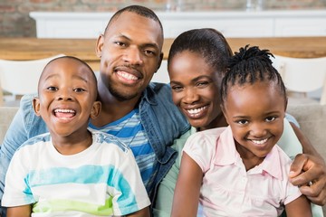 Wall Mural - Happy family relaxing on the couch