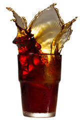 Wall Mural - Splashing cola in glass. Isolated on white background