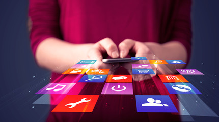 Poster - Woman holding smart phone with colorful application icons