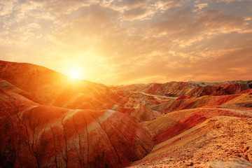 Wall Mural - landscape of red sandstone in sunrise in zhangye