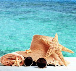 Summer accessories on sea background