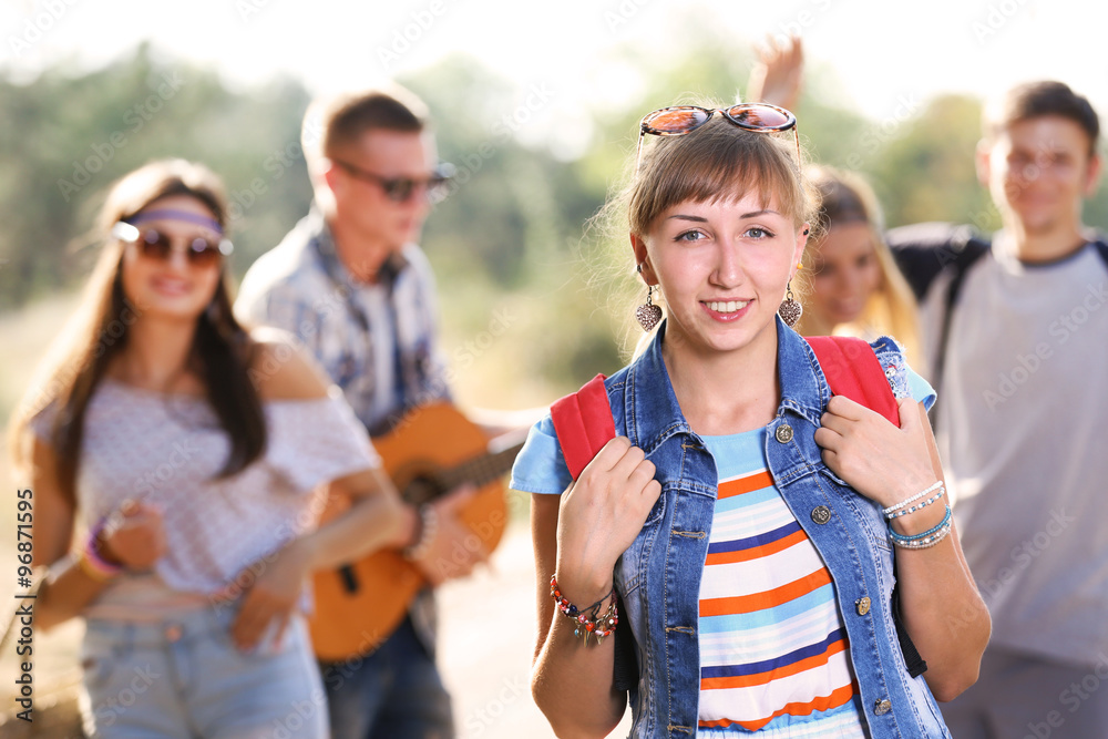 Pretty girl with friends, outdoors