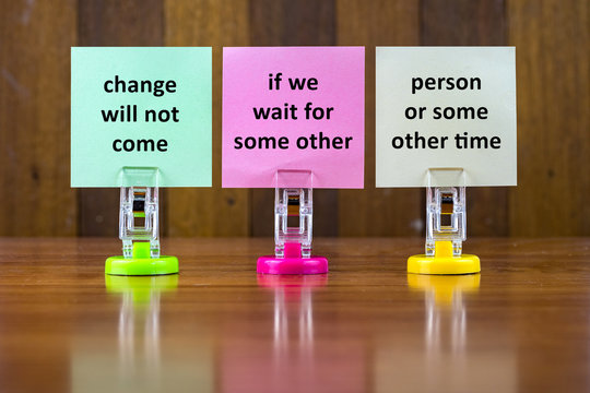 Word quotes of CHANGE WILL NOT COME IF WE WAIT FOR SOME OTHER PERSON OR SOME OTHER TIME on colorful sticky papers against wooden textured background.