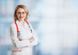 Doctor or physician woman over abstract medical background