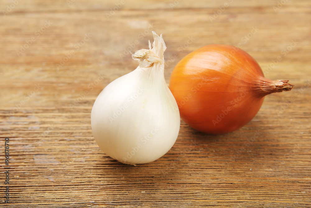 Onion on wooden background