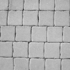 Canvas Print - Gray brick urban pavement, background photo texture