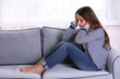 © Africa Studio - Young upset girl sitting on the sofa in her room