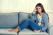 © Africa Studio - Young upset girl sitting on the sofa in her room