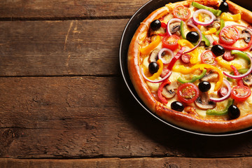 Sticker - Delicious pizza with vegetables, on wooden table, close-up