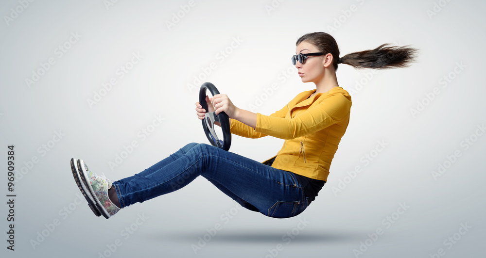 Young beautiful girl in sunglasses driver car with a wheel, auto concept - obrazy, fototapety, plakaty 