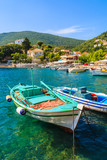 Fototapeta  - Fishing boats on turquoise sea water in Kioni port, Ithaka island, Greece