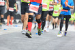 © lzf - Marathon running race, people feet on city road