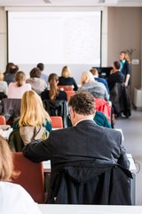 Person attending a conference. 