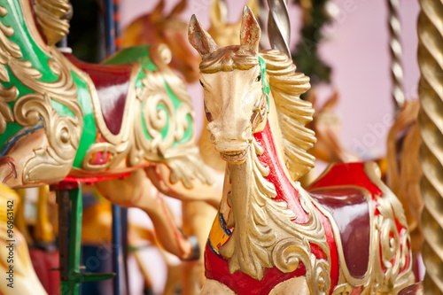 Fotografie, Obraz Carousel. Horses on a carnival Merry Go Round.