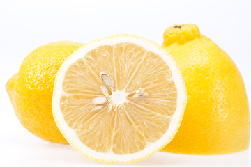 Wall Mural - pieces of fresh yellow fruit of lemon  on white background