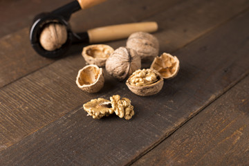 Wall Mural - walnuts with nutcracker on a rustic table